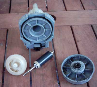 Askoll produced Whirlpool dishwasher recirculation pump shown stripped down with the bearing and armature exposed