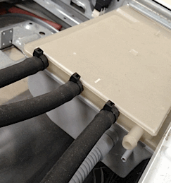 A washing machine detergent compartment seen from the rear