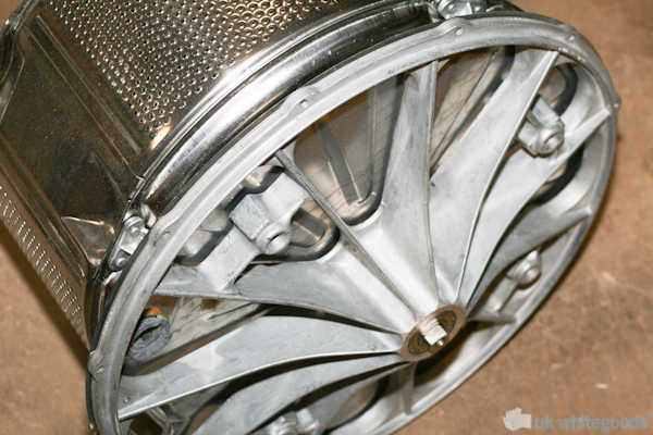 Bearing Housing In A Washing Machine :: This image shows the rear bearing housing of this particular washing machine and you can see the drum shaft to the very back