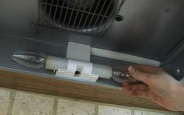 Changing the light bulbs in a cooker hood