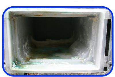 a washing machine soap drawer caked in soap and softener