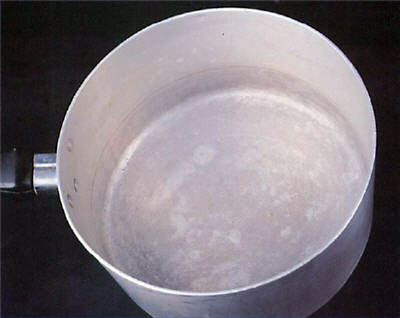 An example of a discoloured aluminium pot washed in a dishwasher