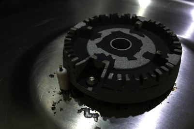 Under the burner cap on a gas hob burner