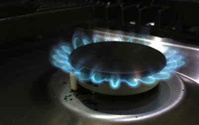 A healthy flame on a gas hob burner 