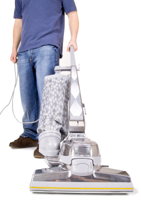 hoovering the carpet with a big old hoover