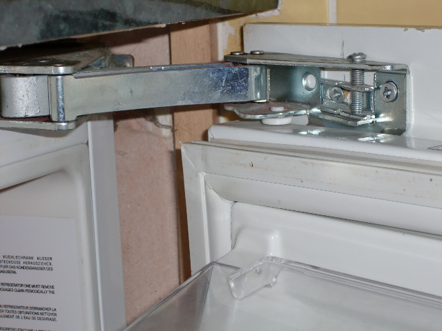 Integrated Fridge Door Hinge :: A typical Ingol hinge installed in an integrated undercounter fridge