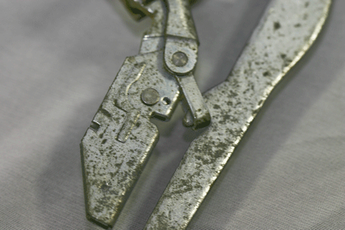 typical continental style oven door hinge showing the hinge lock in the locked open state