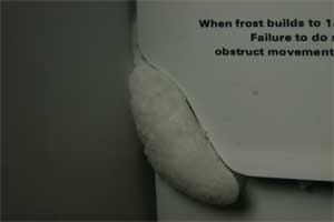 An iced up fridge door caused by air getting into the fridge