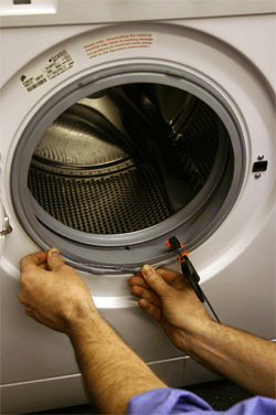 refitting the outer door seal clamp to the washing machine