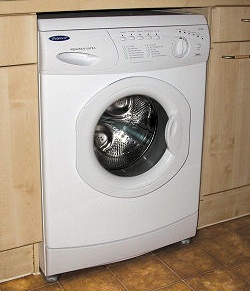 A typical installation of a freestanding washing machine