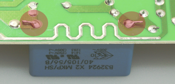 The C1 capacitor mounting points on the rear electronic control unit for Whirlpool made American side by side fridge freezer models