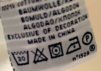 A typical fabric care lable found on a man's shirt