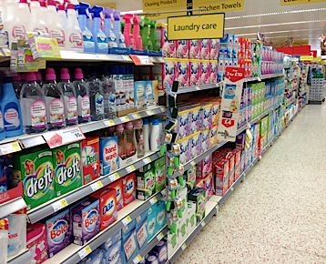 The soap detergent aisle in a UK supermarket with a confusing array of detergents